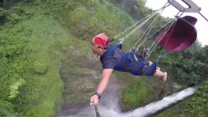 Illustration : "He tackles one of the highest ziplines in the world. Thankfully for us, he had brought a camera along. Honestly, would you dare try it?"